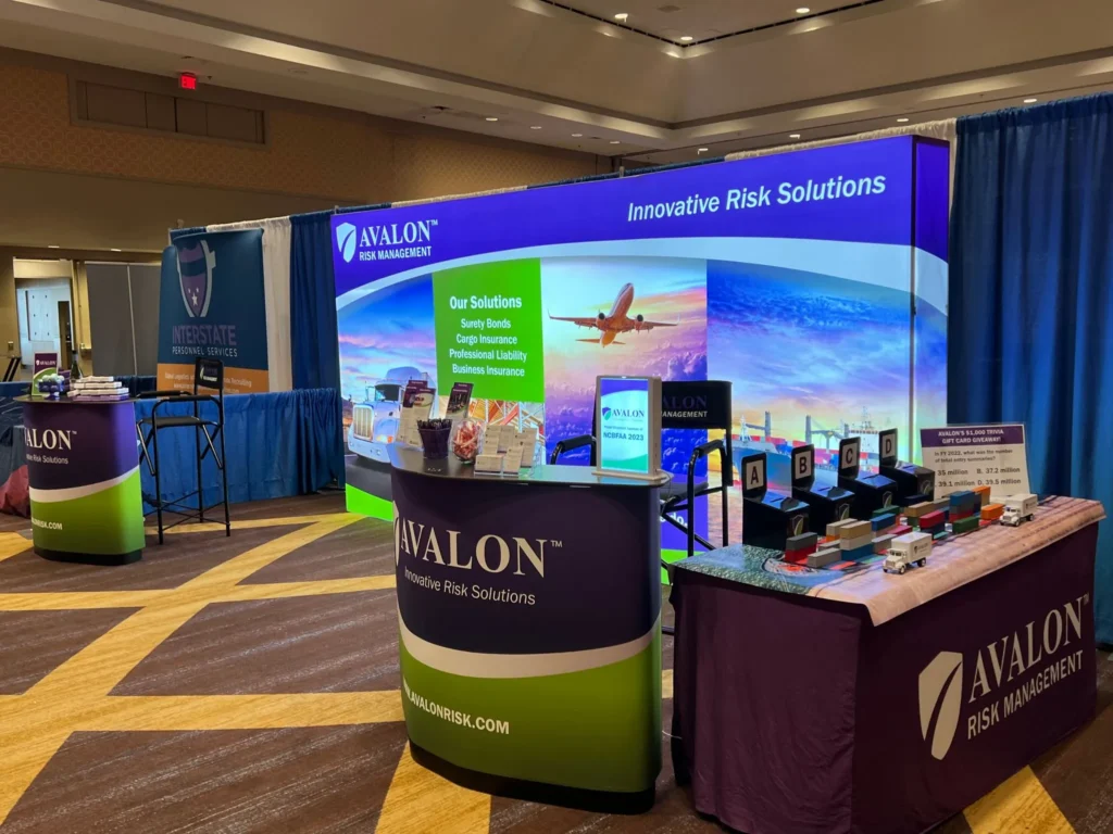 Trade show booth with a branded fabric display backdrop