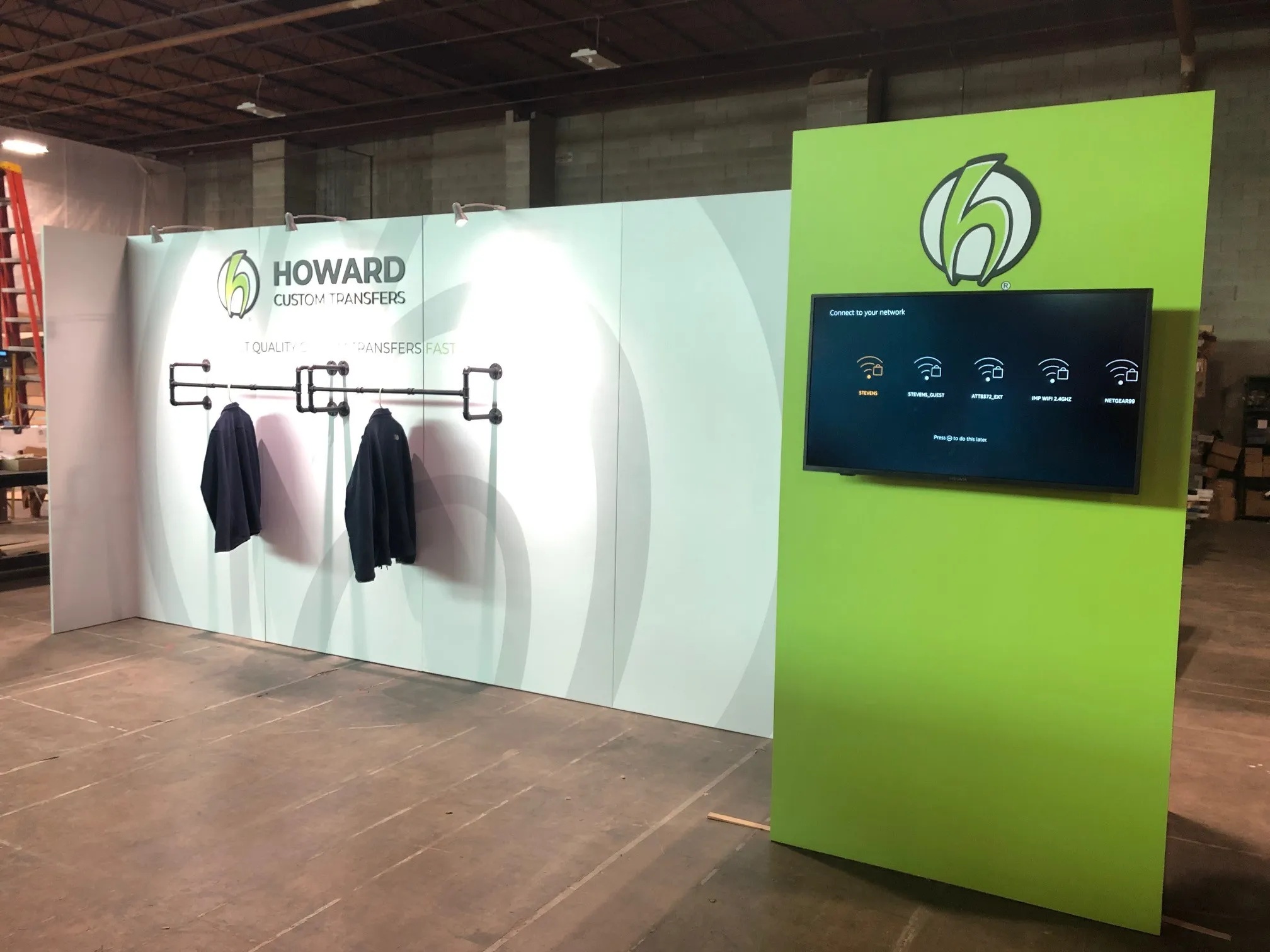 Flawless 20-foot backwall trade show display with vibrant graphics printed and installed in Chicago