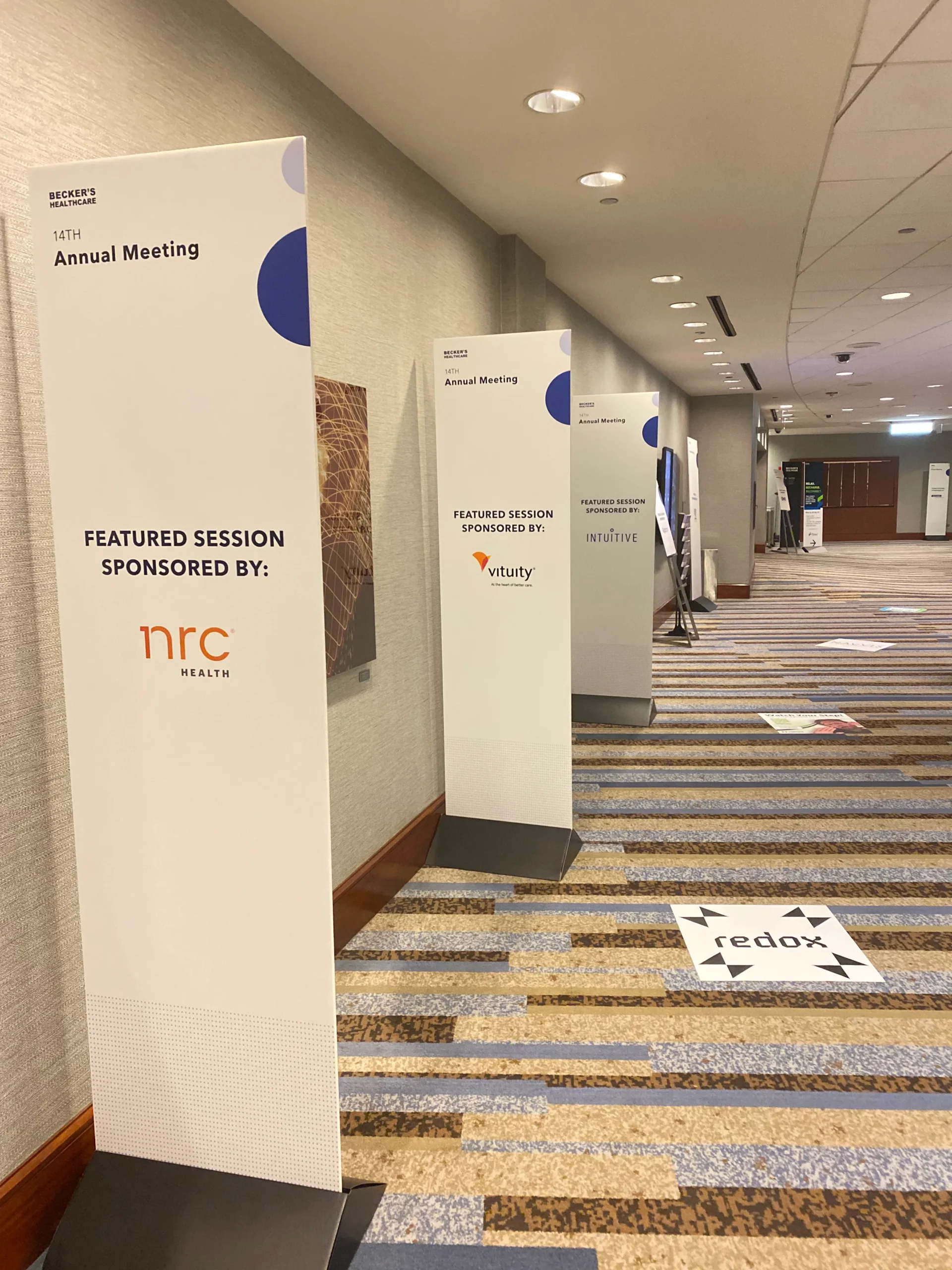 Our Chicago graphics team reviewing a last-minute trade show signage order for fast production and delivery