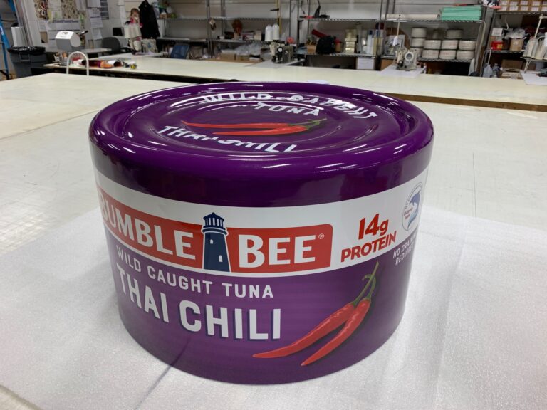 Large cylindrical Bumble Bee Tuna prop wrapped with high-resolution printed 3M vinyl graphics for advertising and film production.Benchmark Imaging