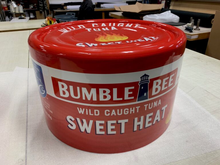 Large cylindrical Bumble Bee Tuna prop wrapped with high-resolution printed 3M vinyl graphics for advertising and film production.Benchmark
