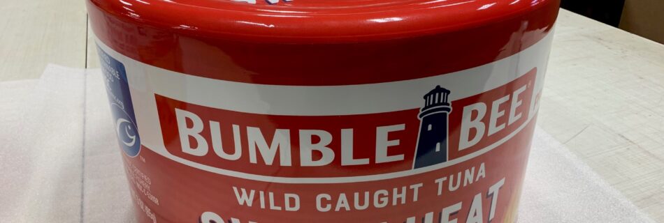 Large cylindrical Bumble Bee Tuna prop wrapped with high-resolution printed 3M vinyl graphics for advertising and film production.Benchmark